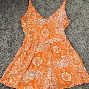 Orange and white paisley romper